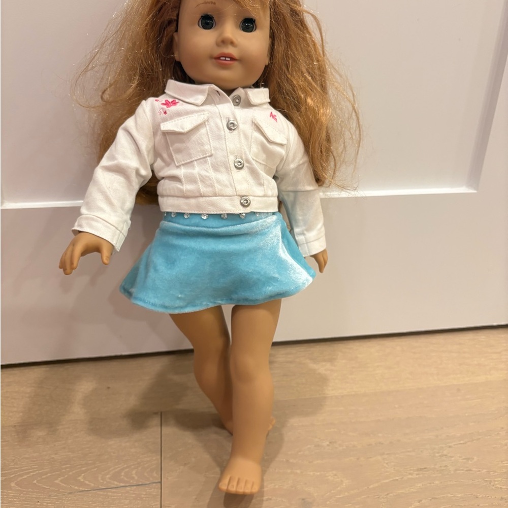 American Girl Doll with White Jacket and Blue Skirt